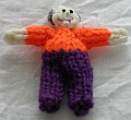 Caucasian, Purple Pants, Orange Shirt, Grey Balding Hair
